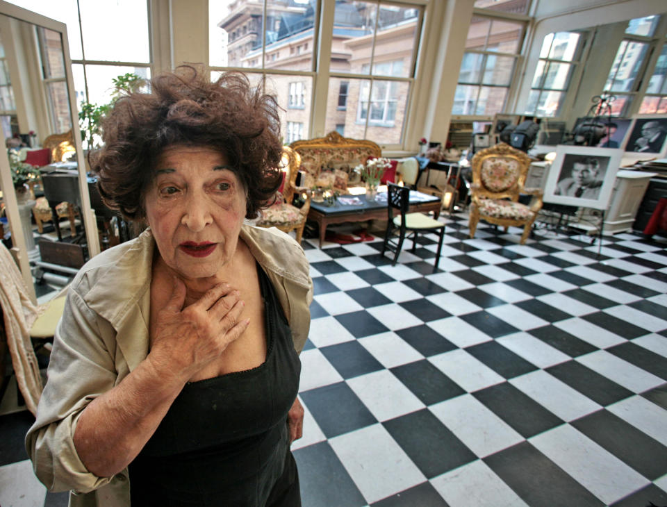 FILE - In this Aug. 2 , 200, file photo, Editta Sherman takes a break from work at her portrait photography studio residence in New York. Sherman, dubbed the "Duchess of Carnegie Hall," because she lived above the famed New York City hall for six decades, died Friday, Nov. 2, 2013 in her sleep, said Billy Lyons, an actor and Sherman's friend. She was 101. (AP Photo/Bebeto Matthews, File)