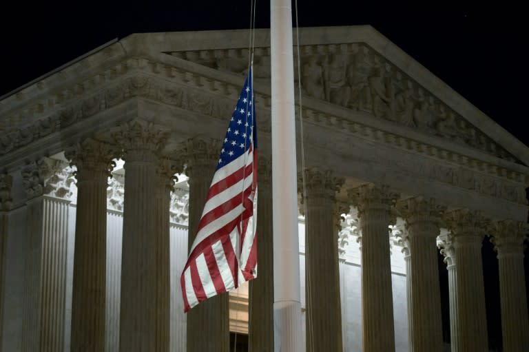 A flag at the US Supreme Court is lowered to half staff on February 13, 2016 in Washington, DC, following the announcement of the death of Supreme Court Justice Antonin Scalia