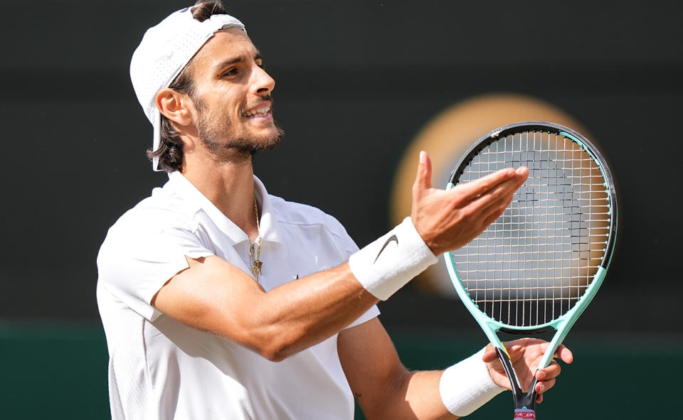 Lorenzo Musetti, pictured here after beating Taylor Fritz to advance to the Wimbledon semi-finals.