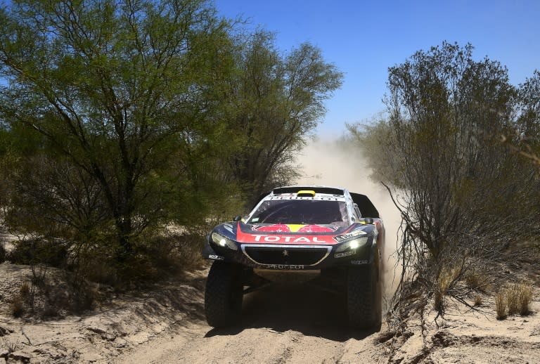 Peugeot's French driver Stephane Peterhansel and co-driver Jean Paul Cottret compete during the Stage 11 of the Rally Dakar 2016 between La Rioja and San Juan, Argentina, on January 14, 2016