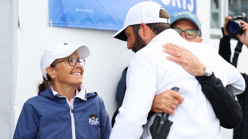 Scheffler is congratulated on another victory by his parents. - Andrew Redington/Getty Images