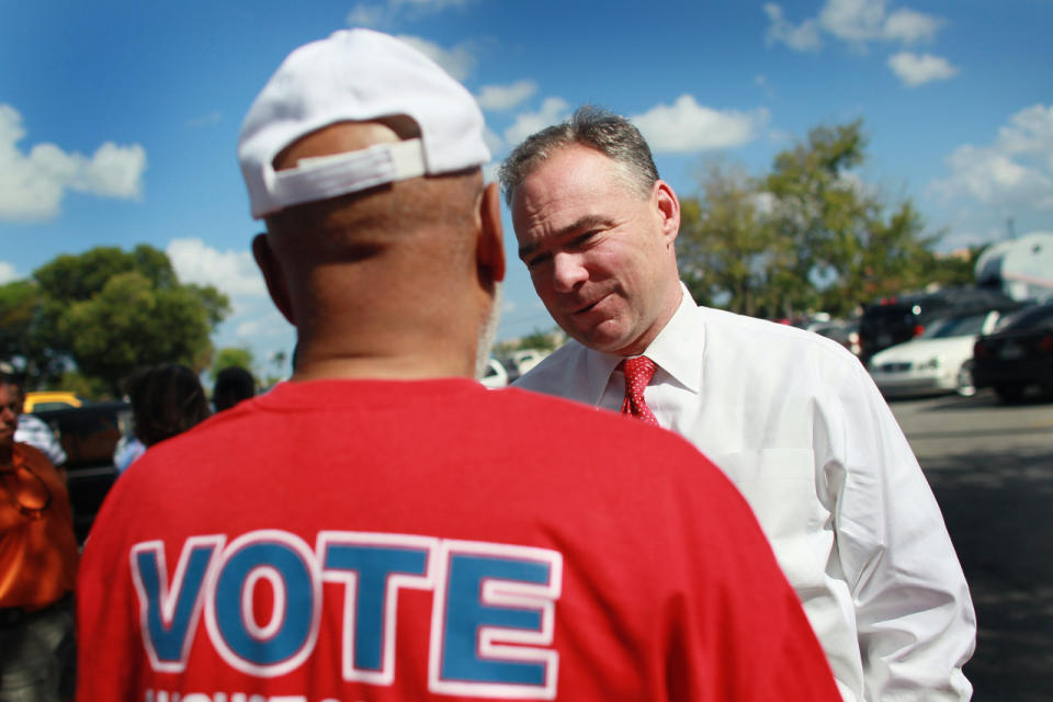 <p>Democratic National Committee Chairman Tim Kaine speaks with Rep. Alcee Hastings, D-Fla., during a stop to encourage voters to participate in the election at an early voting station, Oct. 22, 2010, in Lauderhill, Fla. (Photo: Joe Raedle/Getty Images)</p>