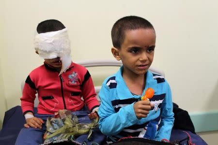 Boys, who Libyan forces said left the last cluster of buildings controlled by Islamic State in the group's former stronghold of Sirte, sit on a bed as they receive medical treatment in a hospital in Misrata, Libya December 4, 2016. REUTERS/Ayman Sahely