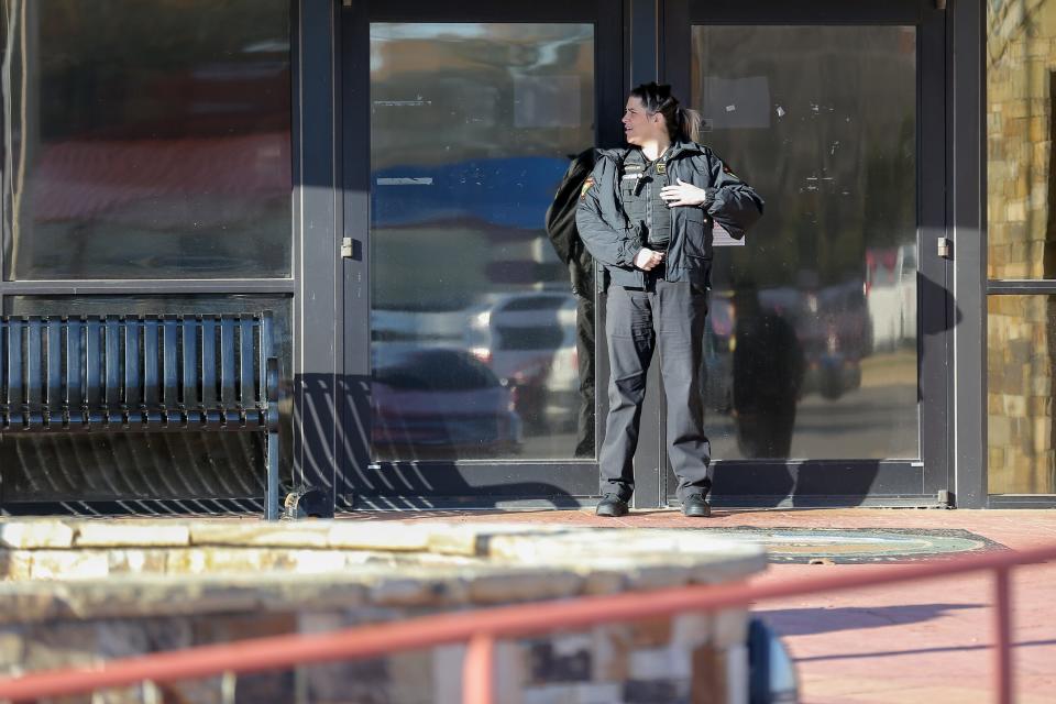 Police guard the entrance to the Muscogee Nation courthouse in Okmulgee on Thursday as plaintiffs and supporters attend a preliminary hearing regarding whether the Muscogee Nation is violating the terms of an 1866 treaty by not recognizing descendants of Freedmen as citizens.