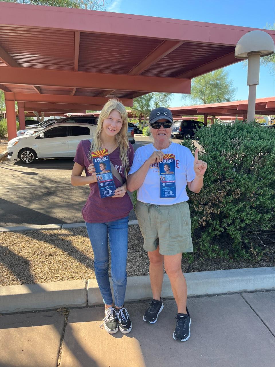 Outside of Paradise Valley Town Hall, Gracie Muehling (left), from Scottsdale, and Mary Wagner, from Paradise Valley hand out brochures to voters.