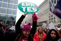 A demonstrator holds a sign calling for an equal rights amendment (ERA) during in the Third Annual Women's March at Freedom Plaza in Washington