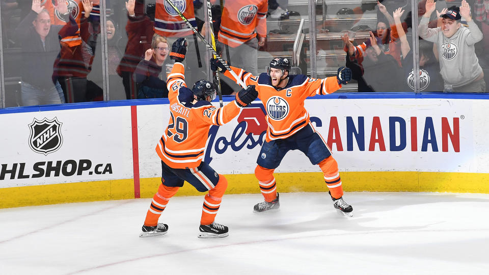 EDMONTON, AB - APRIL 1: Connor McDavid #97 and Leon Draisaitl #29 of the Edmonton Oilers celebrate after winning the game in overtime against the St Louis Blues on April 1, 2022 at Rogers Place in Edmonton, Alberta, Canada. (Photo by Andy Devlin/NHLI via Getty Images)
