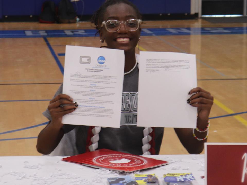 Track and cross country athlete Kiarrah Dixon, 17, holds her signed letter of intent committing to Gilford College in North Carolina at Bear Creek on May 20 in Stockton. Dixon will compete in the 2022 CIF State meet at Buchanan High School in Clovis May 27-28.