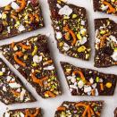 <p>This chocolate bark is the PERFECT 3 P.M. snack. Loaded with dried cherries, pretzels, pistachios, and coconut flakes, it's just as healthy as it is satisfying.</p><p>Get the <a href="https://www.delish.com/uk/cooking/recipes/a29954883/chocolate-bark-recipe/" rel="nofollow noopener" target="_blank" data-ylk="slk:Sweet 'N Salty Chocolate Bark" class="link rapid-noclick-resp">Sweet 'N Salty Chocolate Bark</a> recipe.</p>