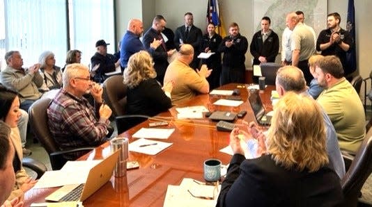 Somerset County Commissioners Chairman Brian Fochtman and Somerset County Jail Warden Brian Pelesky hand out citations to members of the Somerset County Jail at a recent commissioners meeting.