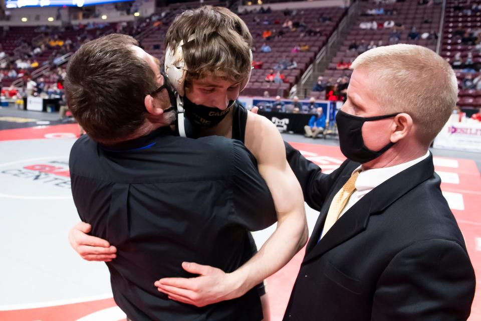 Biglerville's Levi Haines gets picked up by his dad and head coach, Ken Haines, after winning the 145-pound championship bout at the PIAA Class 2A wrestling championship at the Giant Center in Hershey on Friday, March 12, 2021. Haines won by fall at 2:19. 