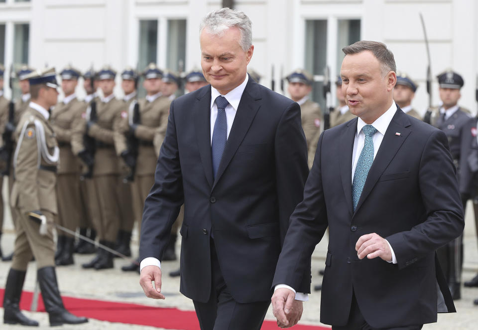 CAPTION CORRECTS THE NAME - Polish President Andrzej Duda, right, and Lithuanian President Gitanas Nauseda, left, attend a military welcome ceremony at the presidential Palace in Warsaw, Poland, Tuesday, July 16, 2019.(AP Photo/Czarek Sokolowski)