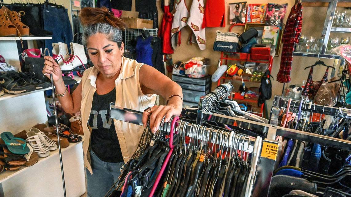 Nohemi Ramirez works in a thrift shop in Huron to make ends meet while the drought keeps her from finding work in the fields. Dry fields are limiting work opportunities for families and making an impact on local businesses in the southwestern town.