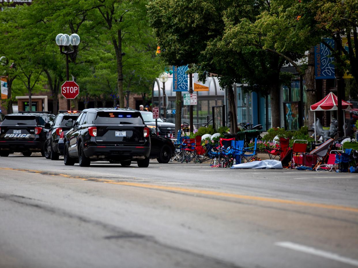 Police vehicles at the scene of the Fourth of July parade shooting in Highland Park, Illinois on Monday.