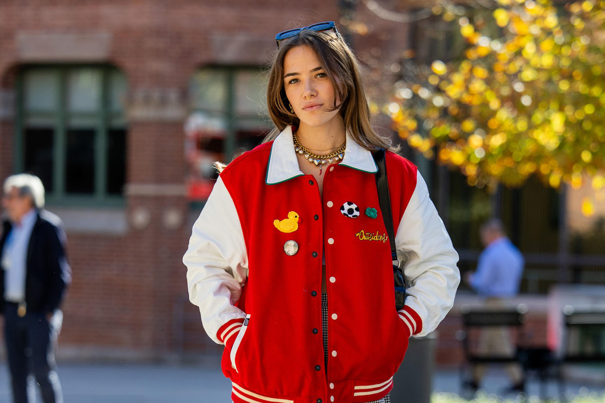 Fashion girl in varsity jacket