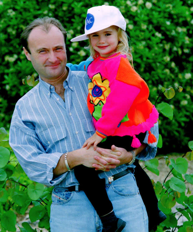 Phil Collins and Lily Collins<p>Dave Hogan/Hulton Archive/Getty Images</p>