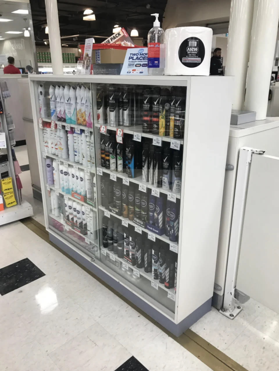 The aerosol deodorant cabinet at the Coles store in Brisbane was locked behind a cabinet.