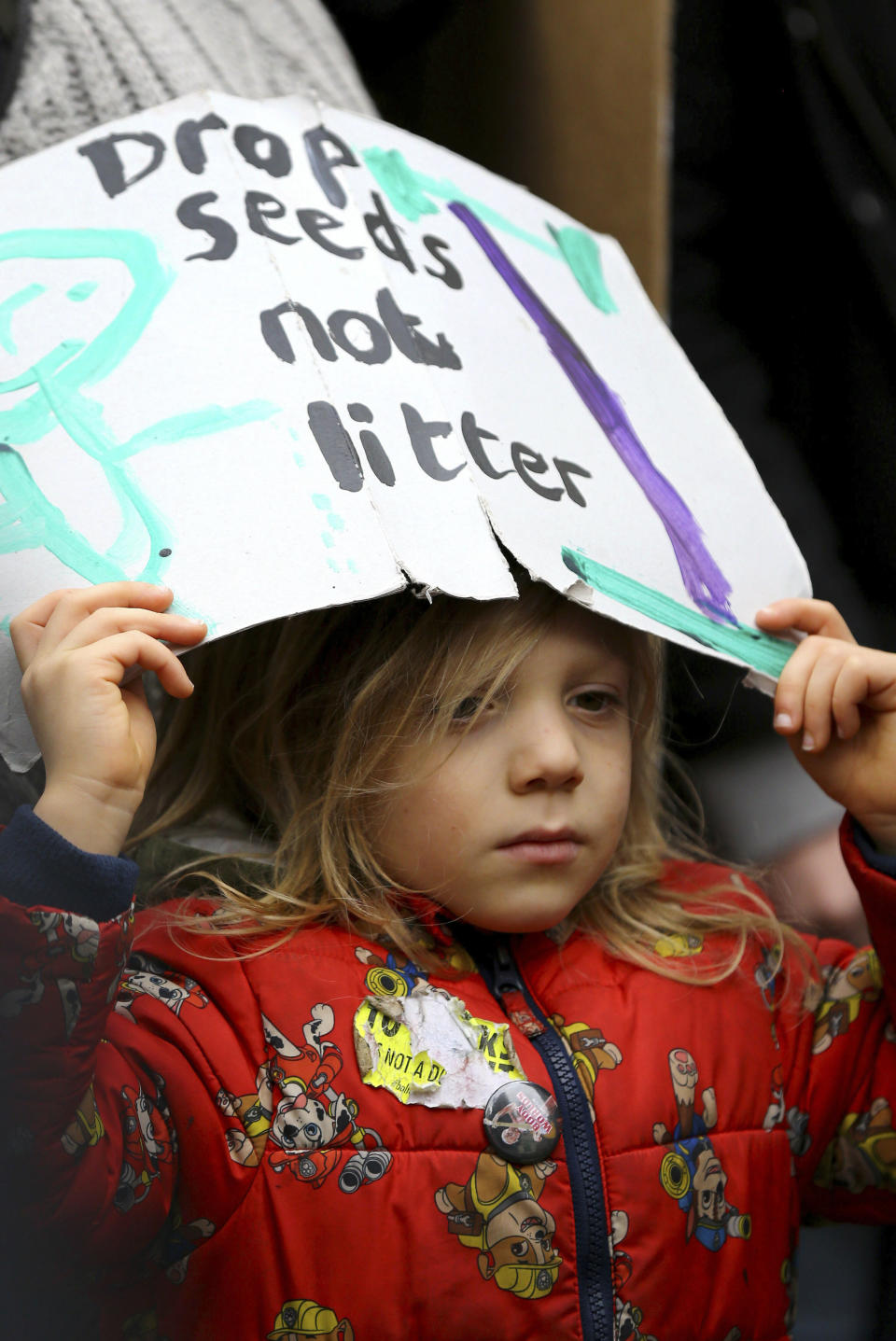 A young student takes part in a global school strike for climate change in Canterbury, south east England, Friday March 15, 2019. Students mobilized by word of mouth and social media skipped class Friday to protest what they believe are their governments’ failure to take though action against global warming. (Gareth Fuller/PA via AP)