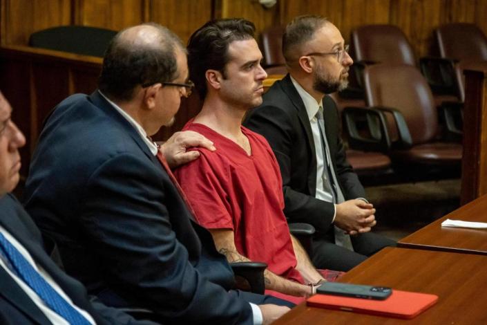 Attorney Phillip Reizenstein places his hand on Pablo Lyle’s shoulder as the sentence is read by Judge Marisa Tinkler Mendez on Friday, Feb. 3, 2023.