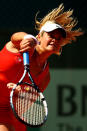 PARIS, FRANCE - MAY 30: Aleksandra Wozniak of Canada serves during the women's singles second round match between Aleksandra Wozniak of Canada and Jie Zheng of China during day four of the French Open at Roland Garros on May 30, 2012 in Paris, France. (Photo by Clive Brunskill/Getty Images)