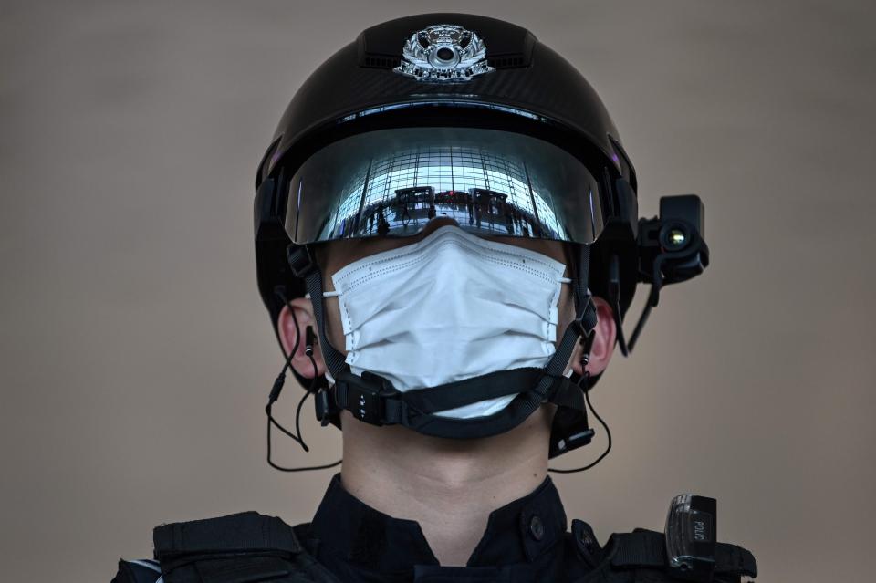 A police officer wearing a face mask stands guard at Tianhe Airport after it was reopened on April, 8, 2020, in Wuhan in China's central Hubei province.