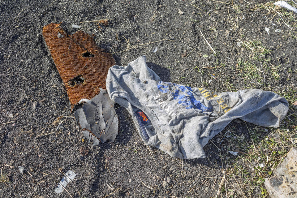 Clothing lies on the ground at the crash scene of an Ethiopian Airlines flight crash near Bishoftu, or Debre Zeit, south of Addis Ababa, Ethiopia, Monday, March 11, 2019. (Photo: Mulugeta Ayene/AP)  