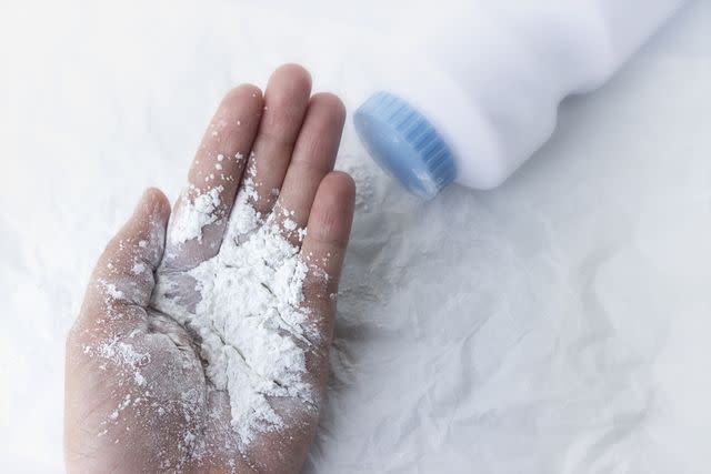 <p>Anchalee Phanmaha / Getty Images</p> Stock image of baby powder spilled out on a white table.