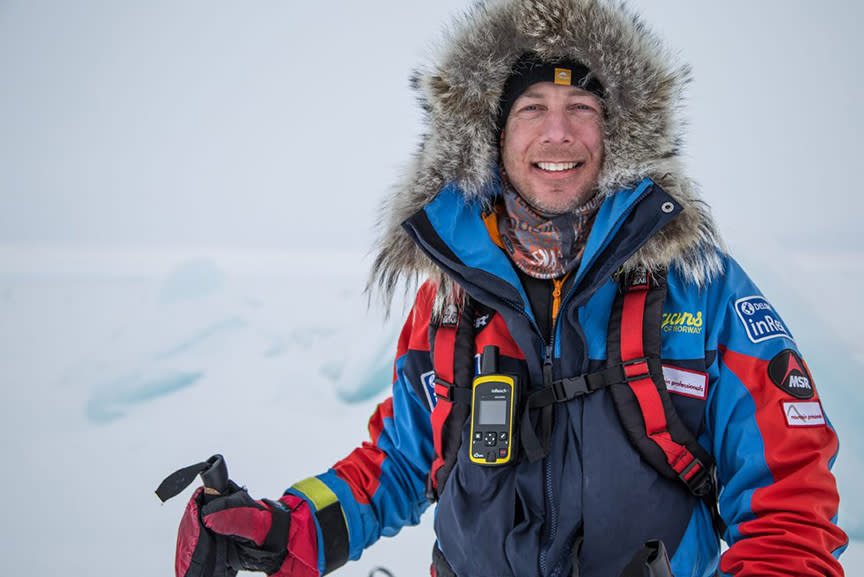 man in fur ruff in arctic environment