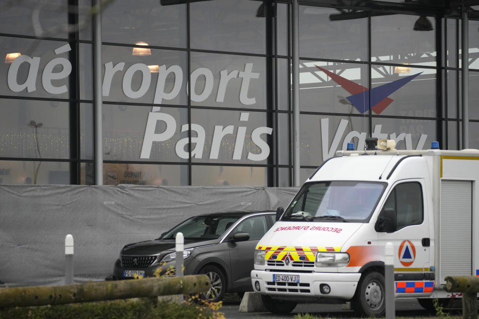 A rescue vehicle parks outside the Vatry airport, eastern France, Saturday, Dec. 23, 2023 in Vatry, eastern France. About 300 Indian citizens heading to Central America were sequestered in a French airport for a third day Saturday because of an investigation into suspected human trafficking, authorities said. The 15 crew members of the Legend Airlines charter flight en route from United Arab Emirates to Nicaragua were questioned and released, according to a lawyer for the small Romania-based airline. (AP Photo/Christophe Ena)