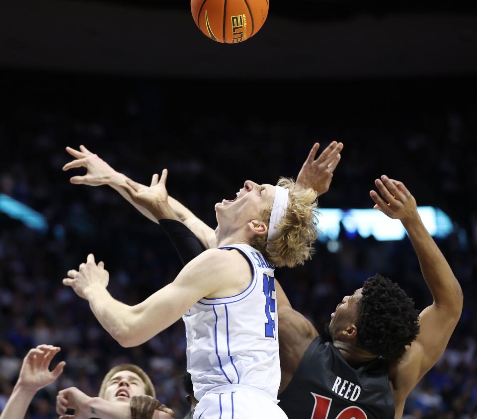 Brigham Young Cougars guard Richie Saunders (15) competes with Cincinnati Bearcats guard Josh Reed (10) for the ball in Provo on Saturday, Jan. 6, 2024. Cincinnati won 71-60. | Jeffrey D. Allred, Deseret News
