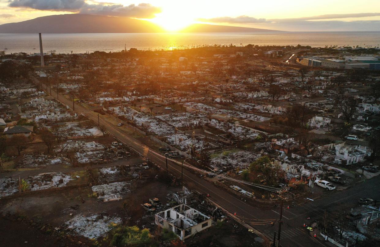 In an aerial view, burned structures and cars are seen two months after a devastating wildfire on October 9, 2023 in Lahaina, Hawaii.