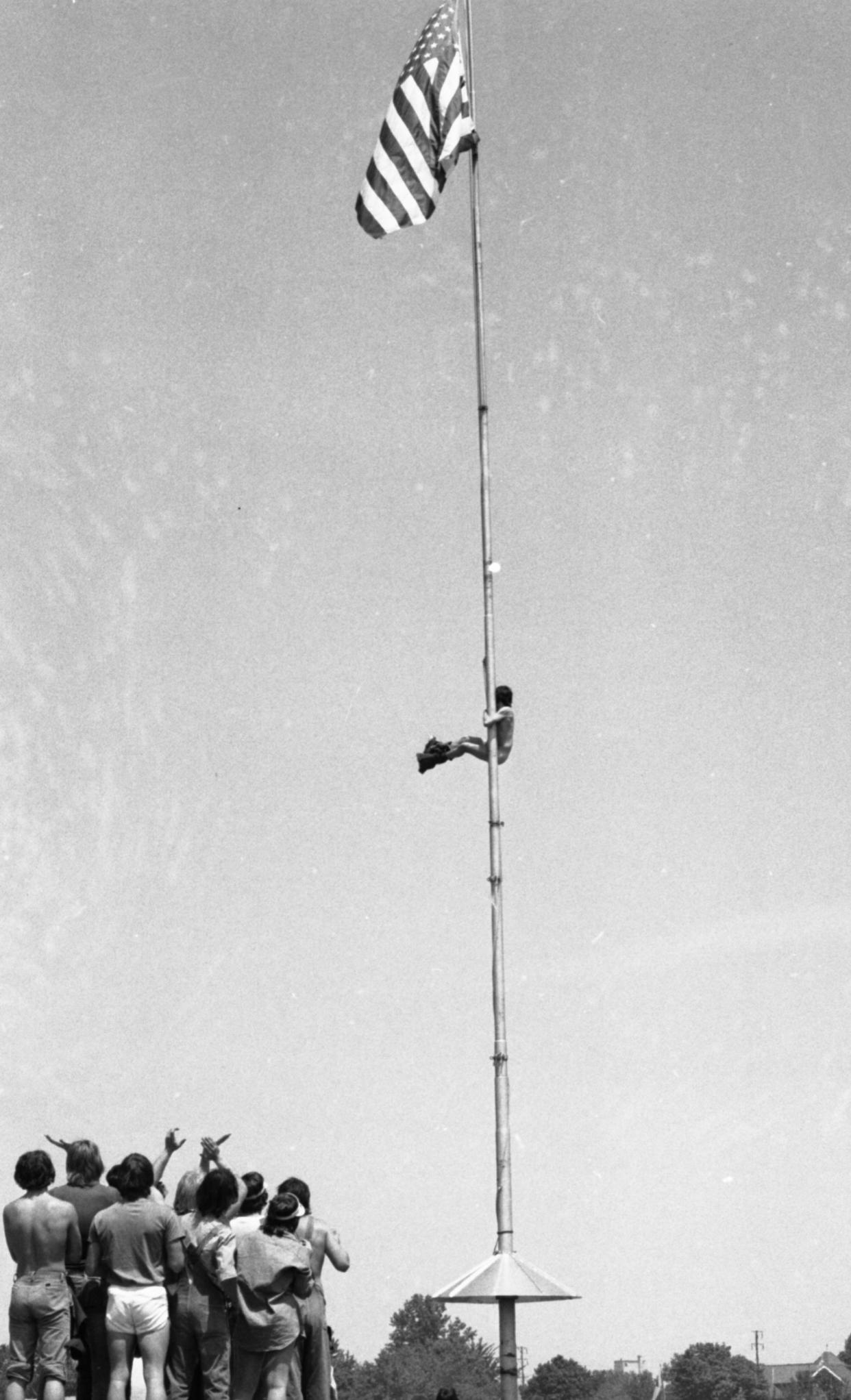 Kentucky Derby: The infield ogles a striptease atop flagpole at Churchill Downs. 
May 4, 1974

Photo by Keith Williams, THE COURIER-JOURNAL