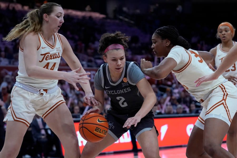 Iowa State guard Arianna Jackson (2) is pressured by Texas forward Taylor Jones, left, and guard Rori Harmon (3) during the first half of an NCAA college basketball game in Austin, Texas, Saturday, Feb. 17, 2024. (AP Photo/Eric Gay)