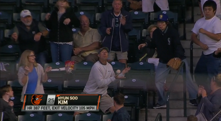 A fan at the Orioles-Mariners game on June 30 misses catching the second of two home runs.