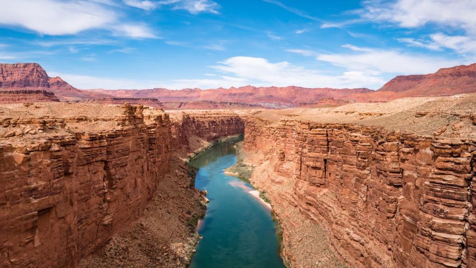 <p>America’s national parks are a treasure. A <a href="http://www.pbs.org/nationalparks/" rel="nofollow noopener" target="_blank" data-ylk="slk:Ken Burns documentary;elm:context_link;itc:0;sec:content-canvas" class="link ">Ken Burns documentary</a> called them "America’s Best Idea." While there are currently 63 of the “big” national parks (think Yellowstone and the Grand Canyon), the National Park Service is filled with National Forests, National Battlefields, <a href="https://www.countryliving.com/life/g32448306/facts-about-national-historic-landmarks/" rel="nofollow noopener" target="_blank" data-ylk="slk:National Historic Landmarks;elm:context_link;itc:0;sec:content-canvas" class="link ">National Historic Landmarks</a>, and more. Some places focus more on natural beauty, while others truly celebrate the history of our great country. </p><p>While not <a href="https://www.countryliving.com/life/travel/g33450032/road-trip-stops-every-state/" rel="nofollow noopener" target="_blank" data-ylk="slk:every state;elm:context_link;itc:0;sec:content-canvas" class="link ">every state</a> is home to one of the official national parks, each state in the union has at least one site that is run by the National Park Service that you should put on your list. And often, the smaller spots are less heavily visited, so you really get a chance to learn and explore something knew. </p><p>If you’ve got kids, don’t forget to ask about the Junior Ranger program. Kids can do worksheets and learn about the parks to keep them engaged, and they’ll be rewarded with a fancy badge (and sometimes a patch!). So while COVID-19 might be keeping many of us close to home and socially distancing from people, once it is safe to <a href="https://www.countryliving.com/life/travel/a33304653/types-of-road-trips/" rel="nofollow noopener" target="_blank" data-ylk="slk:hit the road again;elm:context_link;itc:0;sec:content-canvas" class="link ">hit the road again</a> to travel, put these spectacular spots on your must-see list. For now, some of the parks are closed due to COVID restrictions, or have limited hours, so make sure to call ahead. </p>