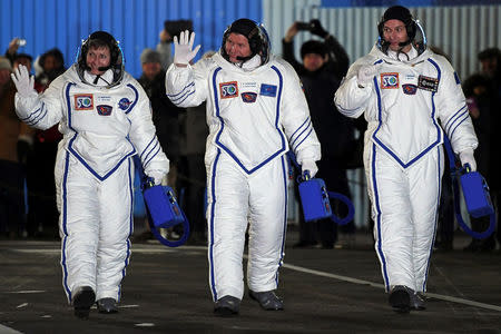 The International Space Station (ISS) crew members Peggy Whitson of the U.S., Oleg Novitskiy of Russia and Thomas Pesquet of France walk to board the Soyuz MS-03 spacecraft for the launch at the Baikonur cosmodrome, Kazakhstan 17 November 2016. REUTERS/Kirill Kudryavtsev/ Pool