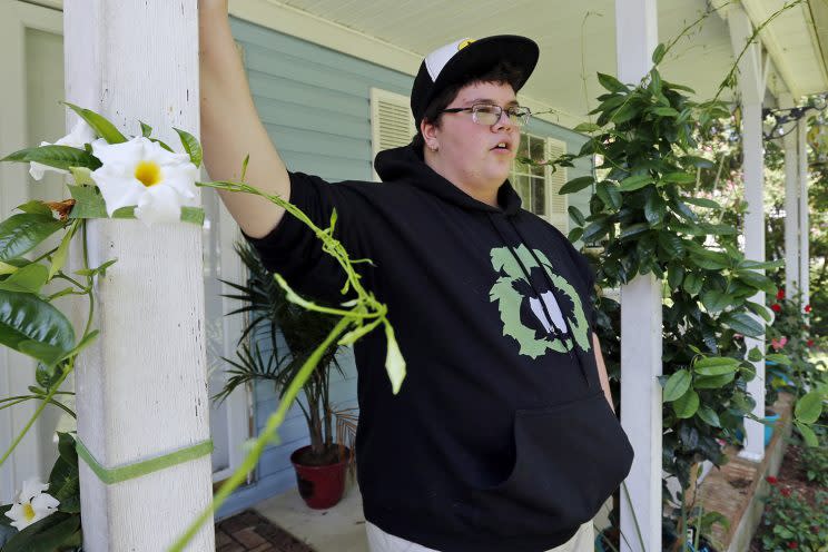 Gavin Grimm leans on a post on his front porch during an interview at his home in Gloucester, Va., in August 2015. (Photo: Steve Helber/AP)