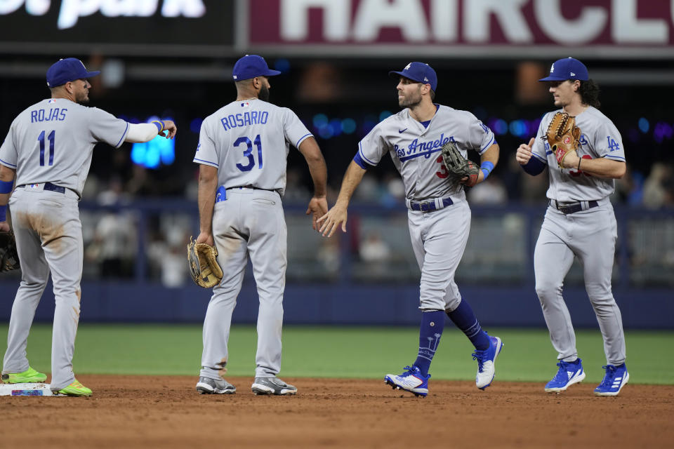 Los Angeles Dodgers players celebrate after the Dodgers beat the Miami Marlins 10-0 in a baseball game, Thursday, Sept. 7, 2023, in Miami. From left, Miguel Rojas, Amed Rosario, Chris Taylor and James Outman. (AP Photo/Wilfredo Lee)