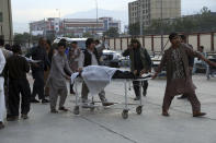 An injured school student is transported to a hospital after a bomb explosion near a school in west of Kabul, Afghanistan, Saturday, May 8, 2021. A bomb exploded near a school in west Kabul on Saturday, killing several people, many them young students, an Afghan government spokesmen said. (AP Photo/Rahmat Gul)