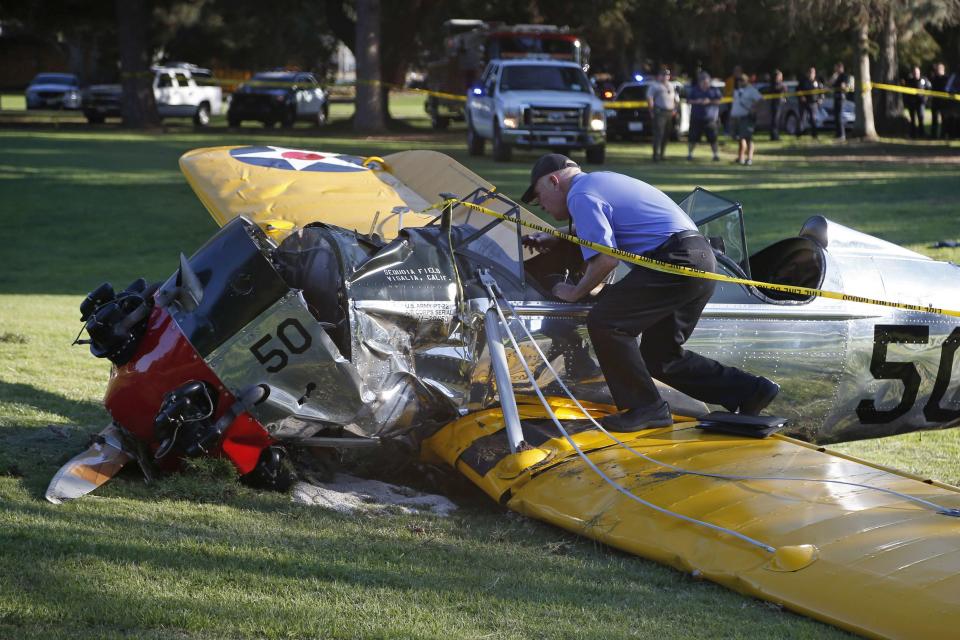 An airplane sits on the ground after crash landing at Penmar Golf Course in Venice, Los Angeles California March 5, 2015. Actor Harrison Ford was injured on Thursday in the crash of a small airplane outside Los Angeles, celebrity website TMZ reported. Reuters could not immediately confirm the report on TMZ, which said that Ford, 72, suffered multiple gashes to his head and was taken to a nearby hospital for treatment. (REUTERS/Lucy Nicholson)