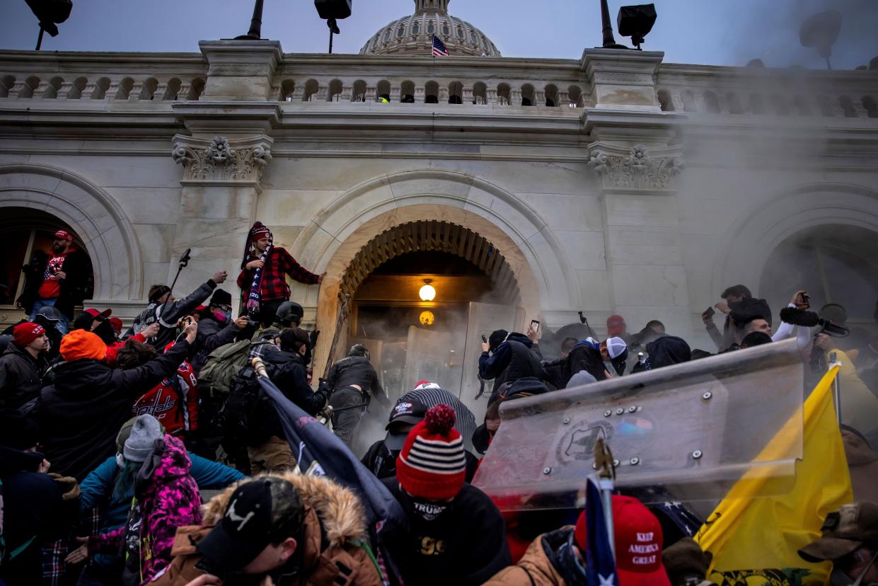 Trump supporters clash with police and security forces as people try to storm the US Capitol on January 6, 2021 in Washington, DC.