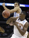 Iowa State's Daniel Edozie, right, and North Carolina's James Michael McAdoo, left, battle for a rebound during the first half of a third-round game in the NCAA college basketball tournament Sunday, March 23, 2014, in San Antonio. (AP Photo/David J. Phillip)