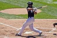 Chicago White Sox's Jose Abreu (79) hits an RBI single during the first inning in the first baseball game of a doubleheader against the Baltimore Orioles, Saturday, May 29, 2021, in Chicago. (AP Photo/Matt Marton)