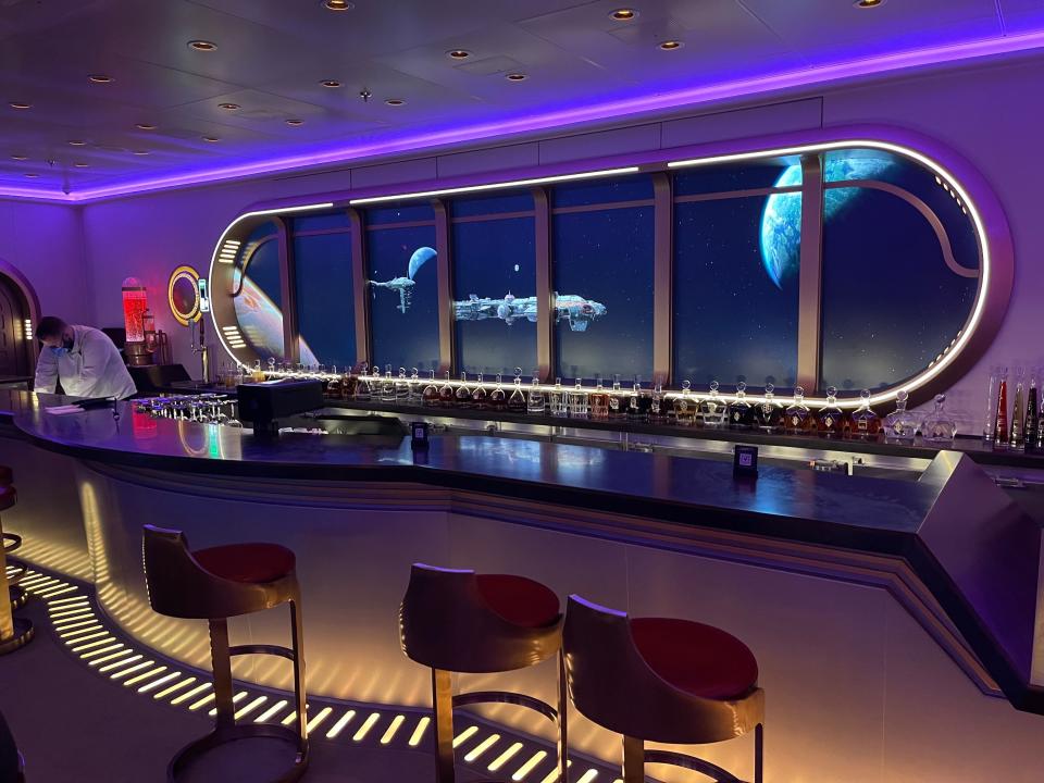 view of the bar at hyperspace star wars lounge on disney wish cruise