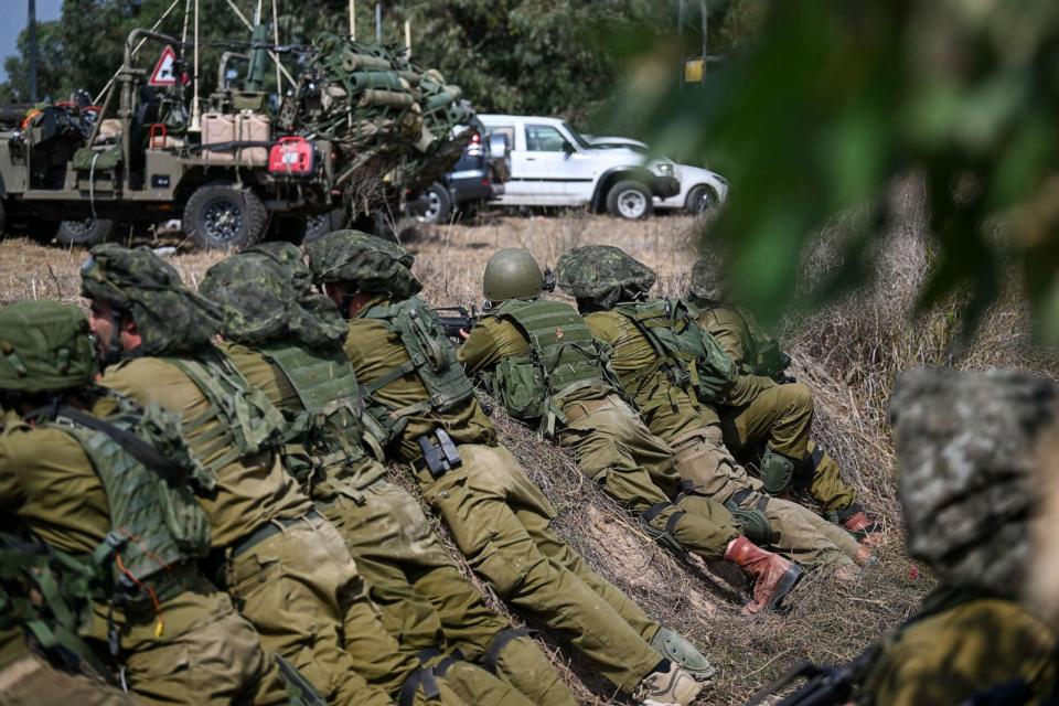 PHOTO: IDF Soldiers wait in a trench, ready to fire, near the border with Gaza, on Oct. 10, 2023 in Kfar Aza, Israel. (Alexi J. Rosenfeld/Getty Images)
