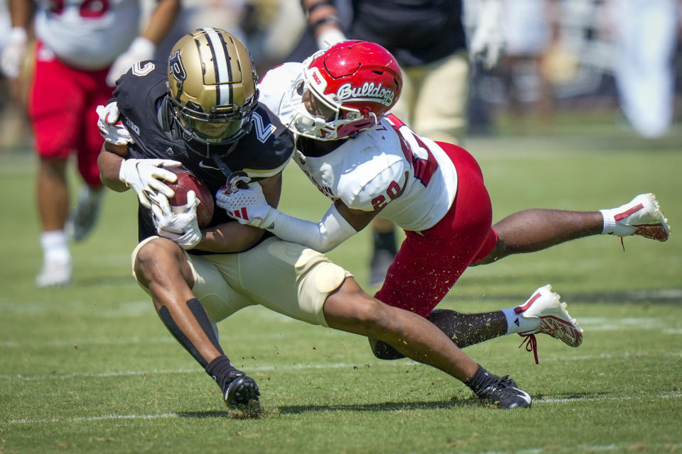 Purdue wide receiver Abdur-Rahmaan Yaseen (2) is caught by Fresno State defensive back Cam Lockridge (20) during the second half of an NCAA college football game in West Lafayette, Ind., Saturday, Sept. 2, 2023. Fresno State won 38-35. (AP Photo/AJ Mast)