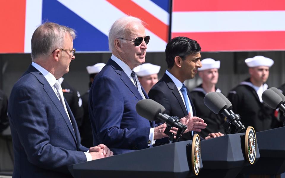 Britain's Prime Minister Rishi Sunak, right, meets with US President Joe Biden and Prime Minister of Australia Anthony Albanese, left, at Point Loma naval base in San Diego, US, Monday March 13, 2023, as part of Aukus, a trilateral security pact between Australia, the UK, and the US. (Leon Neal/Pool via AP) - Leon Neal/Pool via AP