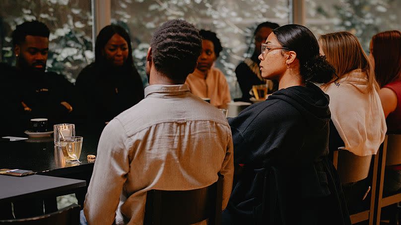 The Book Club gather for a discussion session