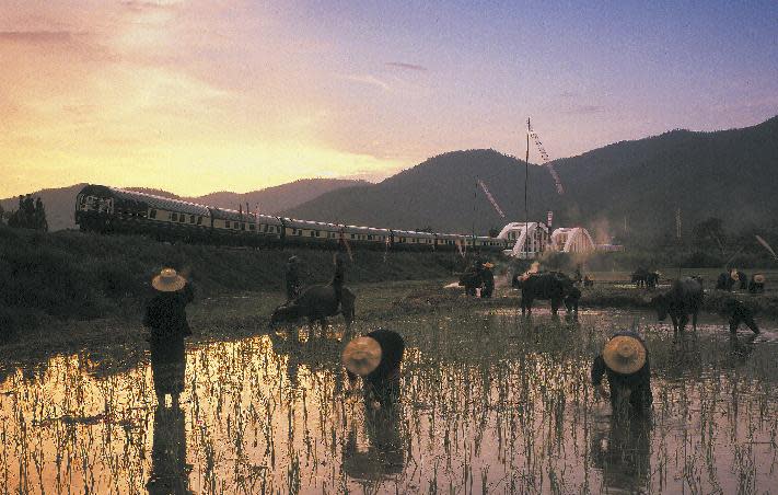 This undated image released by the Eastern & Oriental shows the Eastern & Oriental train crossing the Tha Chompu Bridge near Chiang Mai in Thailand. The Eastern & Oriental is owned by the same company that took over the storied Orient Express, which began running between Paris and Vienna in 1883. That legendary route changed and expanded over time and by the 1930s, the trains also served destinations in central and southern Europe. (AP Photo/Eastern & Oriental)