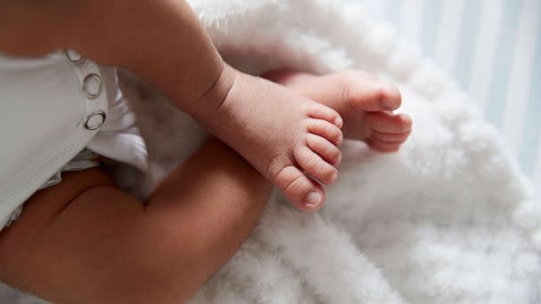 PHOTO: A closeup on a baby's feet in a crib. (STOCK IMAGE/Getty Images)